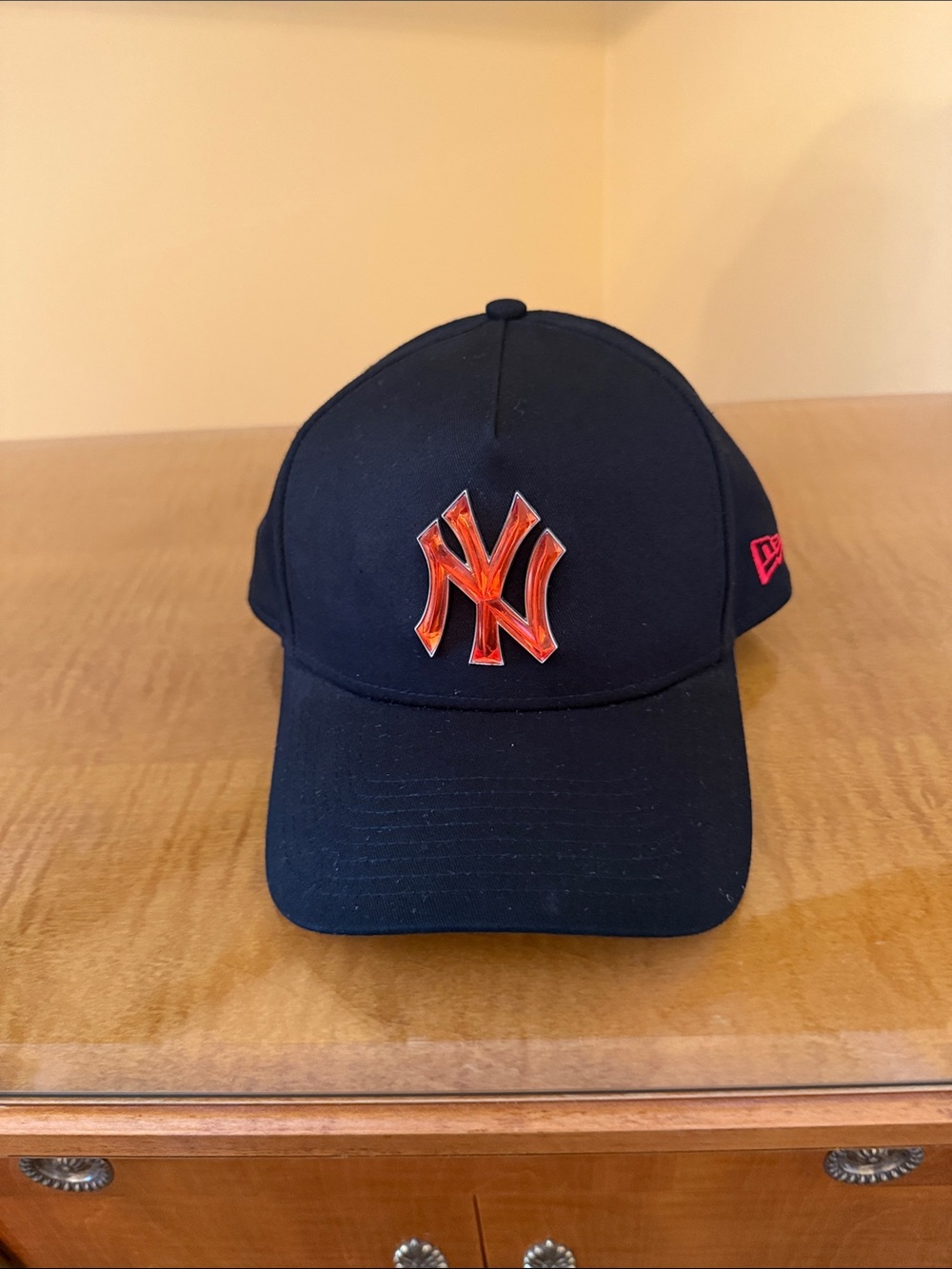New Era Black Cap with Red-Orange NY Emblem